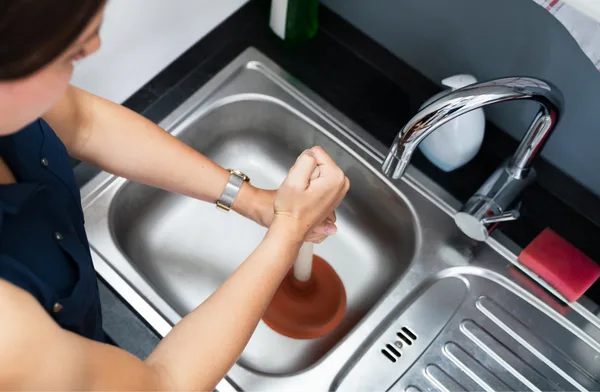 How Do You Clear a Blocked Drain, and When Should You Call a Plumber?