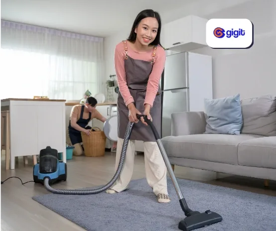 woman cleaning living room